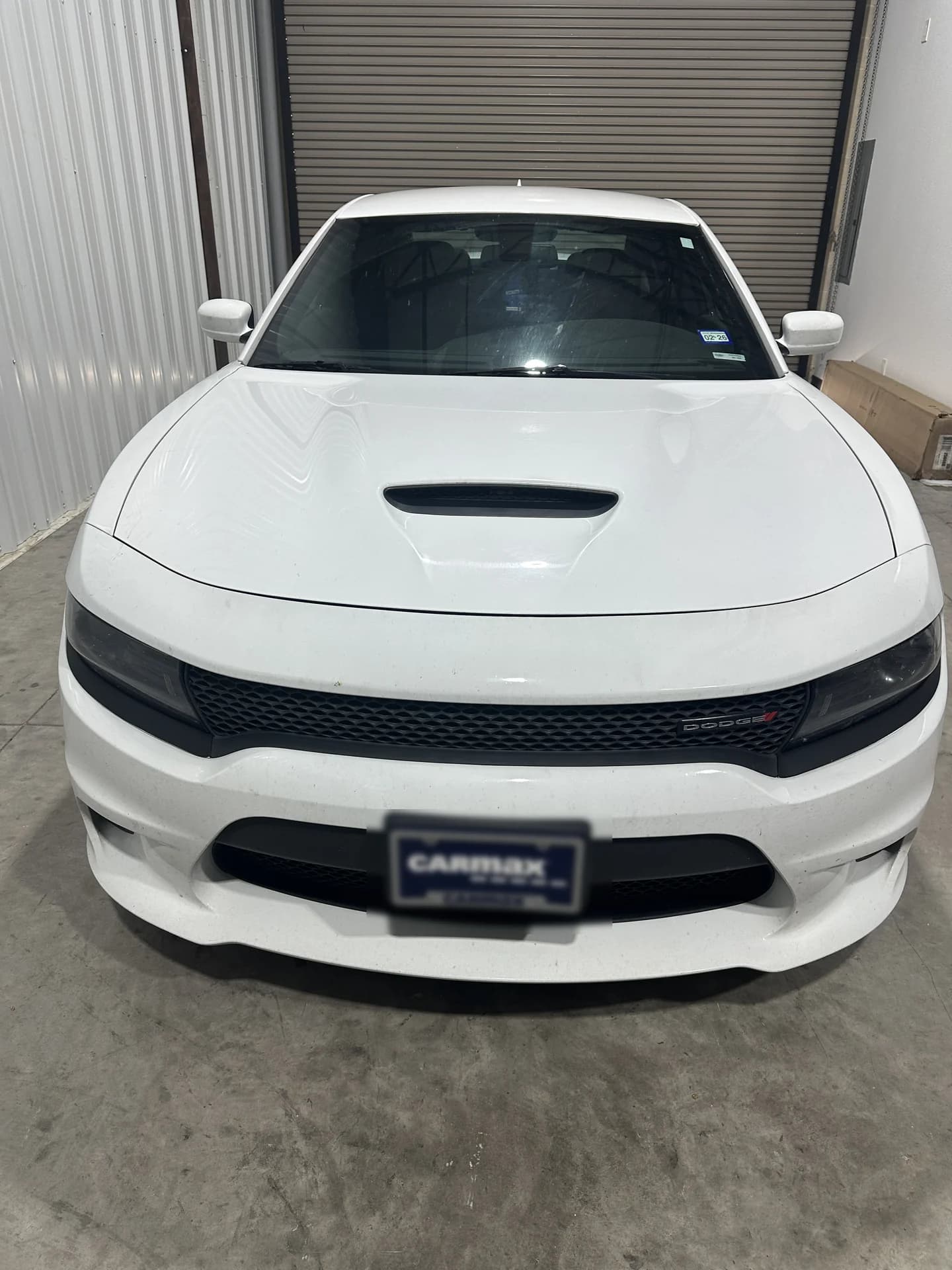 White Dodge Charger at the shop